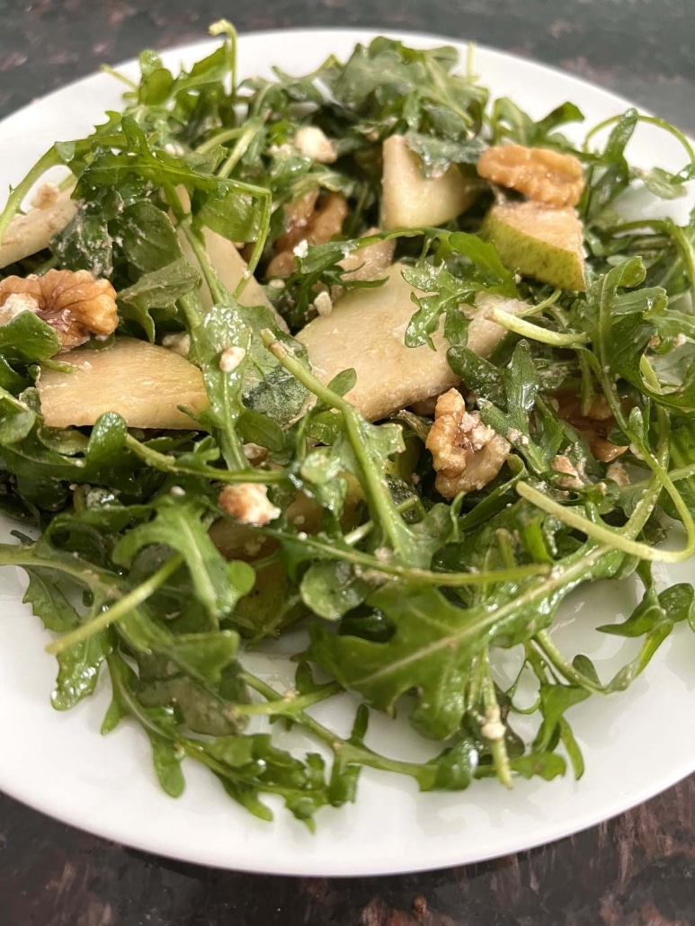 plate of fresh Arugula Pear And Goat Cheese Salad 