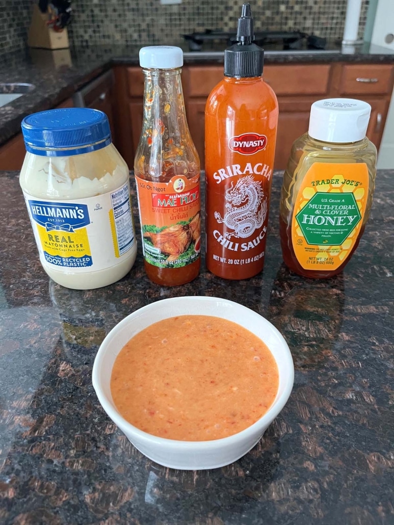 bang bang sauce next to mayo, sweet chili sauce, sriracha, and honey