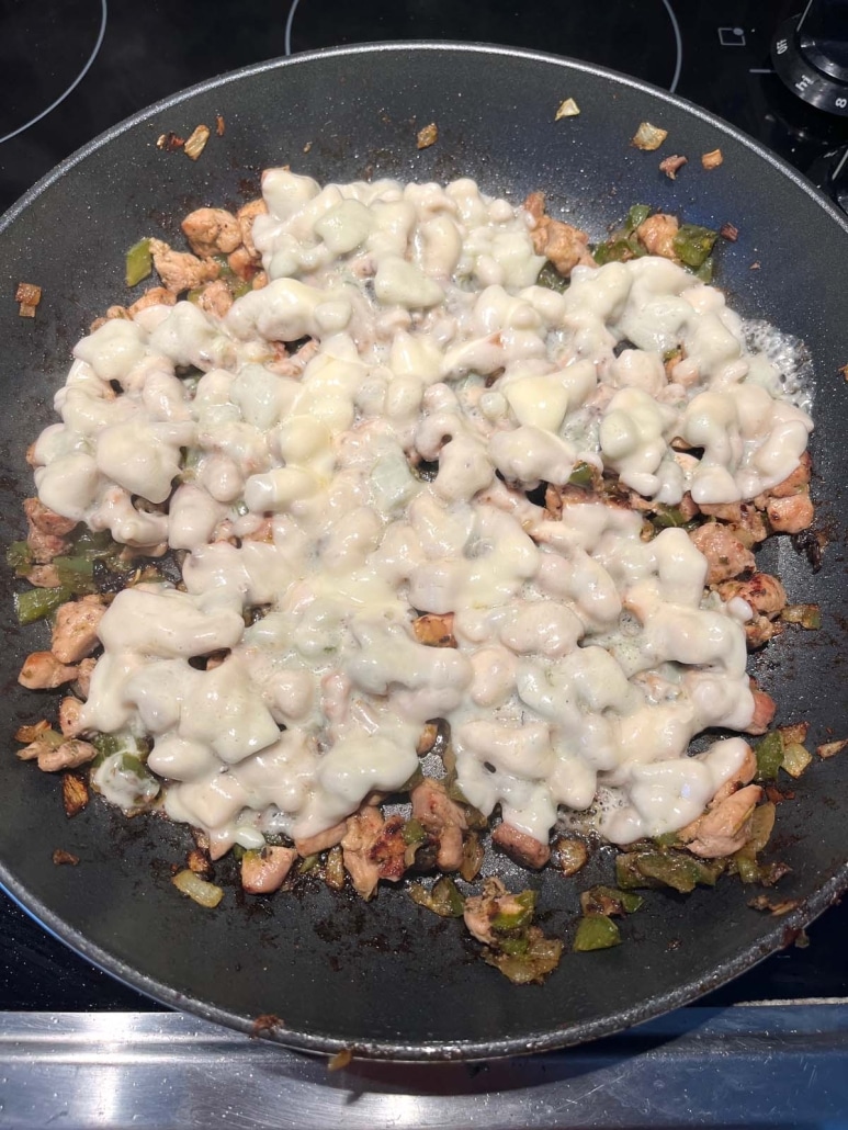 skillet of Chicken Philly Cheesesteak ingredients