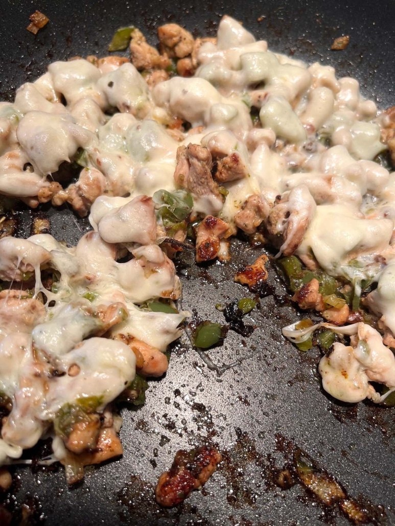 healthier chicken cheesesteak ingredients in a skillet