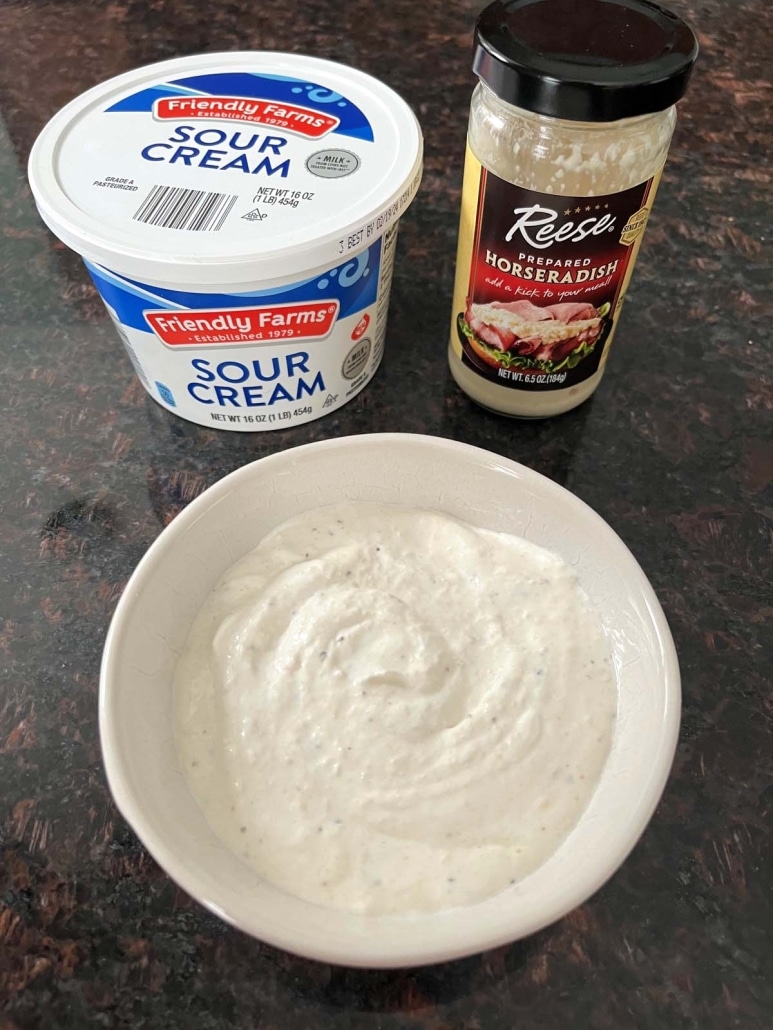 sour cream and horseradish next to a bowl of Creamy Horseradish Sauce