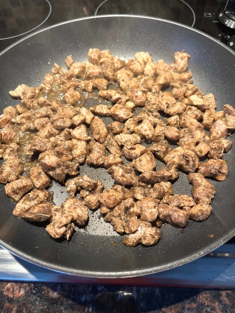 Jamaican jerk seasoned chicken in a skillet