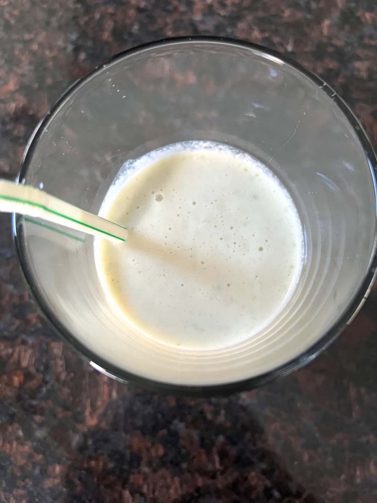 creamy Apple Cinnamon Smoothie in a glass with a straw
