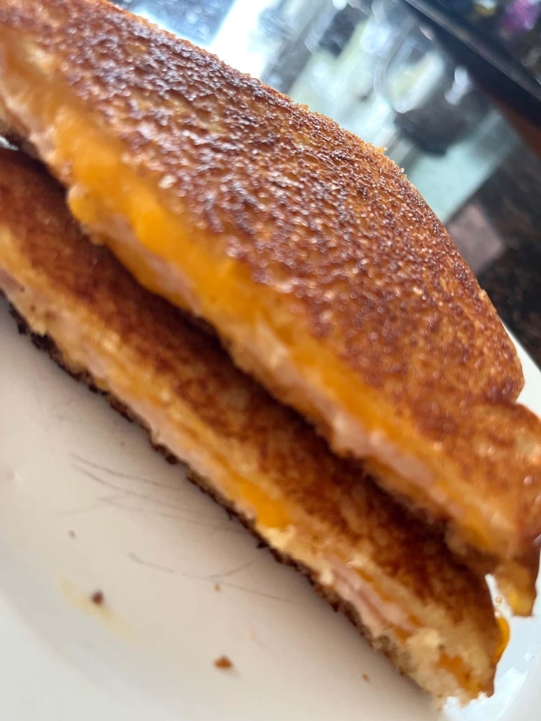 Grilled Turkey And Cheese Sandwich slices stacked on top of each other