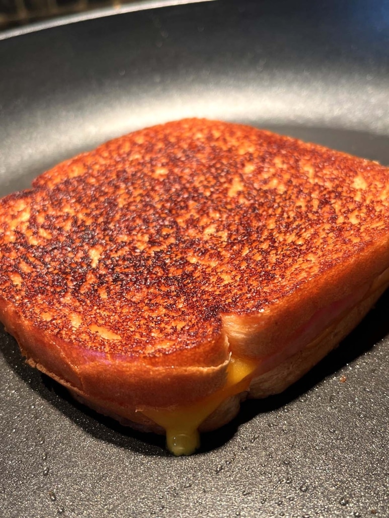 easy lunch Grilled Turkey And Cheese Sandwich on a hot skillet