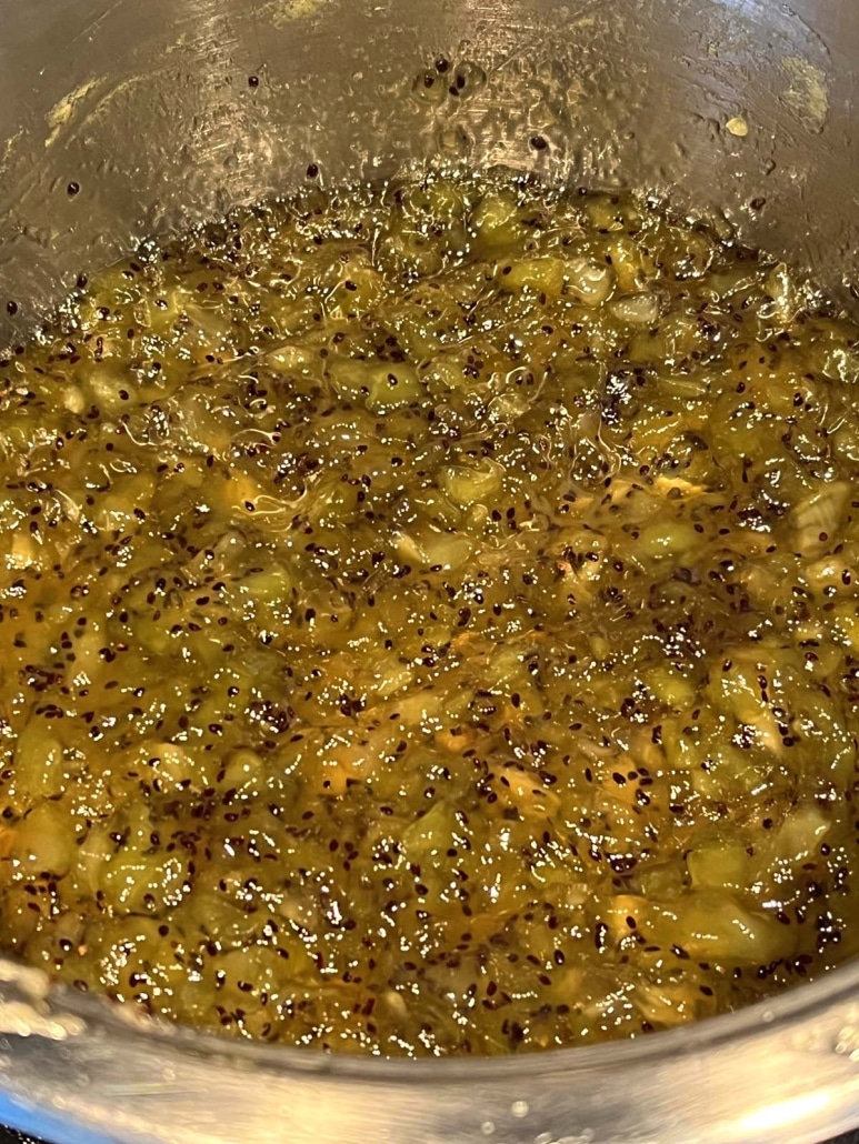 pureed kiwi fruit thickening in a pot