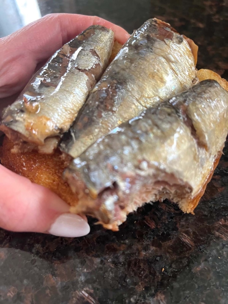 Sardine Toast with a bite out of it