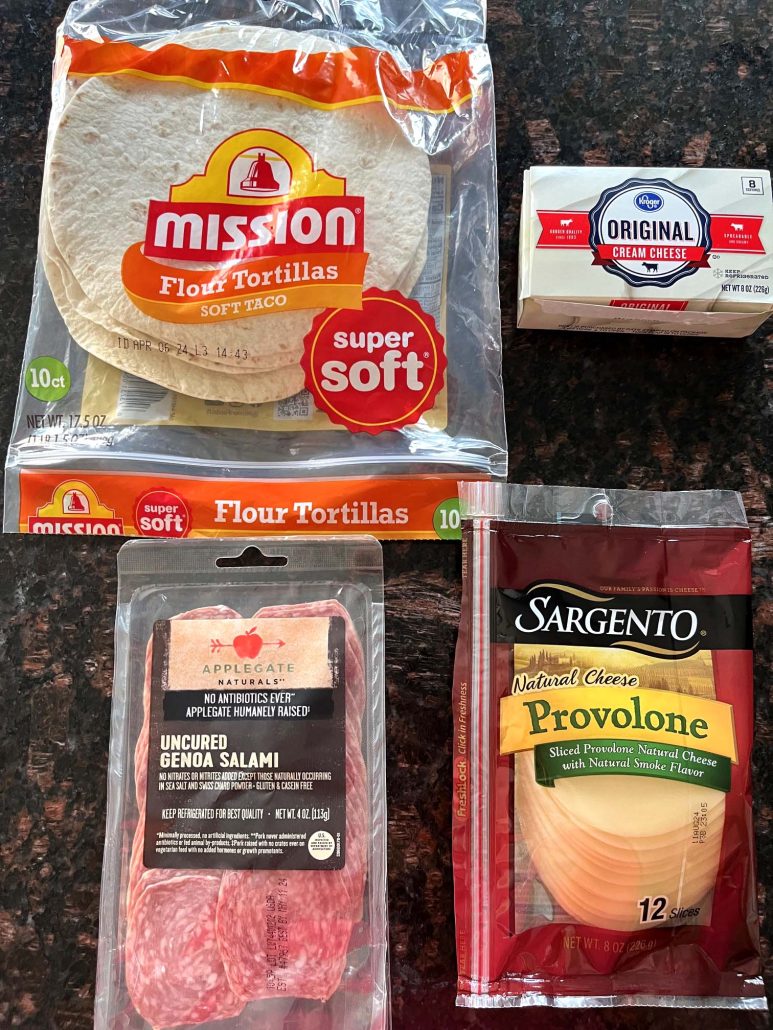 ingredients for Italian pinwheels: tortillas, cream cheese, provolone cheese, and salami