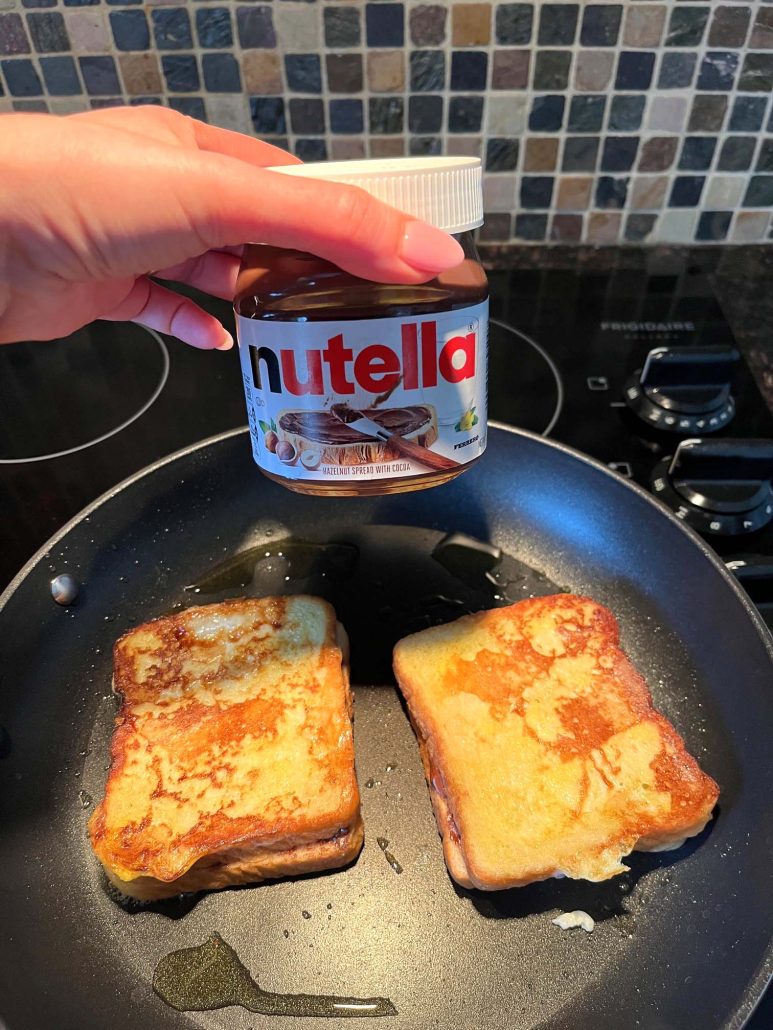 easy and tasty Nutella Stuffed French Toast cooking in a frying pan 