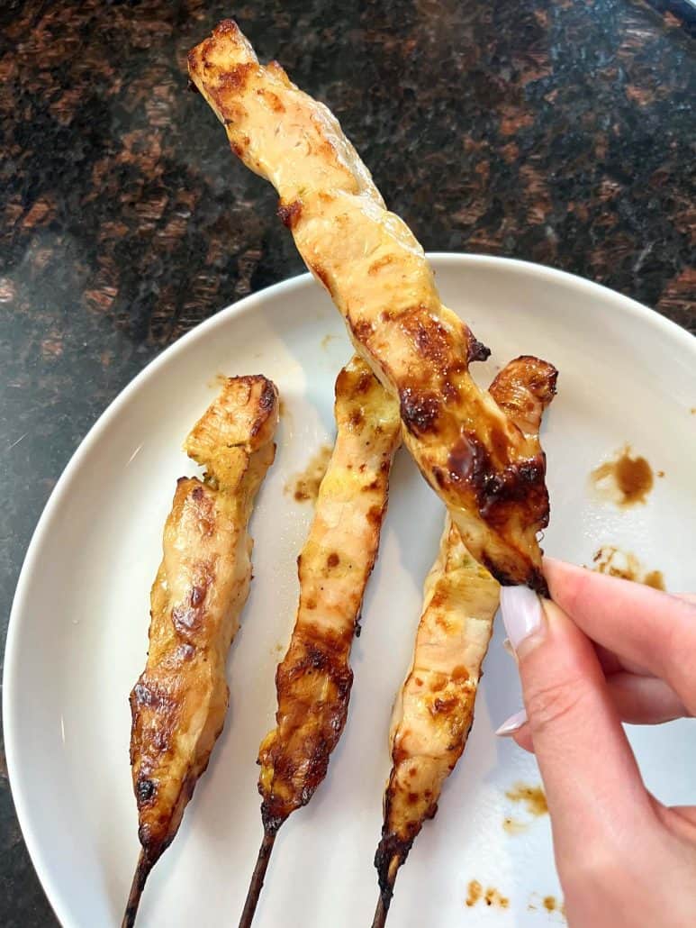 One close-up of chicken breast skewers. 