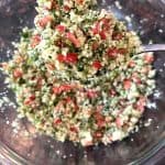 top view of a cauliflower tabbouleh salad place in Pyrex bowl