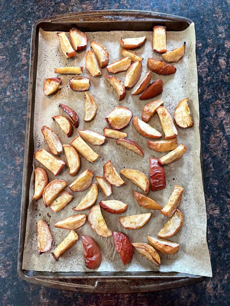 Top view of roasted apples with a crispy, golden-brown surface and juicy interior.