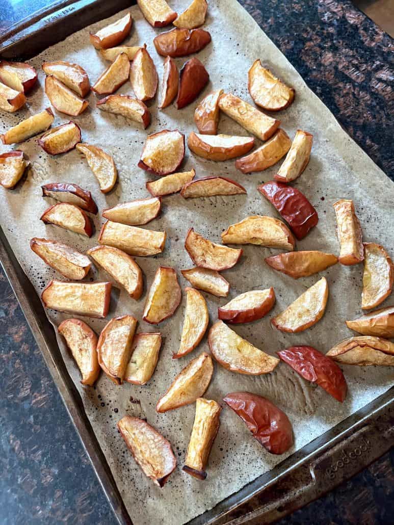 Roasted apples with a golden caramelized crust and soft, tender insides on display.