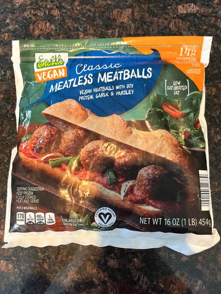 A package of Earth Grown Classic Vegan Meatless Meatballs, made with soy protein, garlic, and parsley, ready for cooking in the air fryer. 