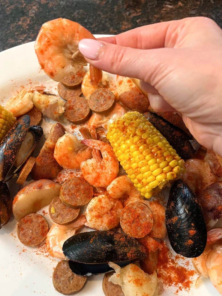 A delicious and appealing seafood feast seasoned with Cajun spices. Ready to enjoy!