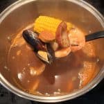 Part of the cooking process for Aldi's Frozen Seafood Boil, ingredients are cooked in boiling water for several minutes until the ingredients become tender.