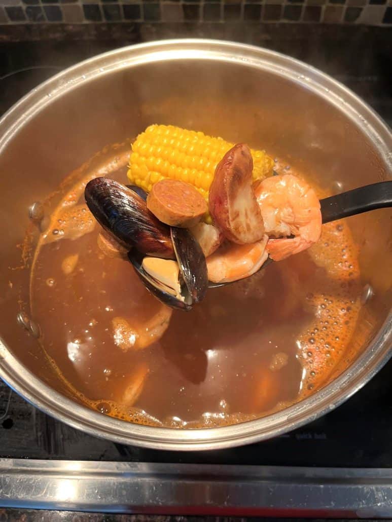 Part of the cooking process for Aldi's Frozen Seafood Boil, ingredients are cooked in boiling water for several minutes until the ingredients become tender.