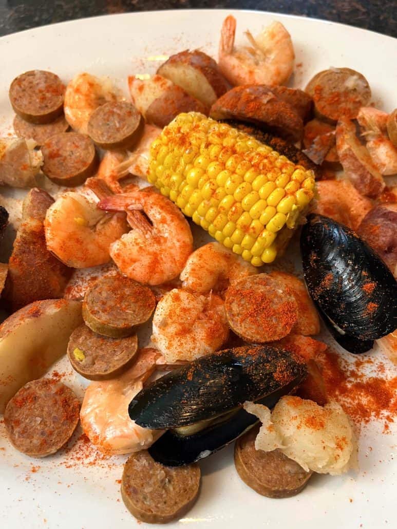 A close-up of mouth watering seafood boil platter.