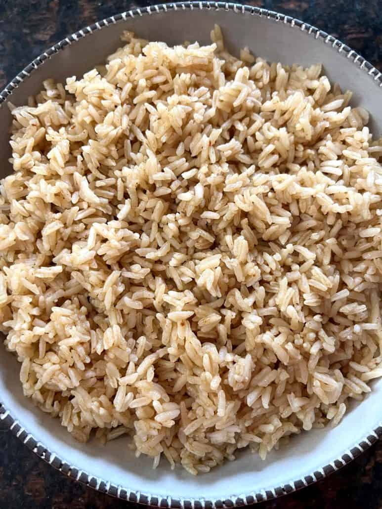 A bowl of fluffy and well-seasoned bone broth rice, with each grain perfectly cooked and separated.