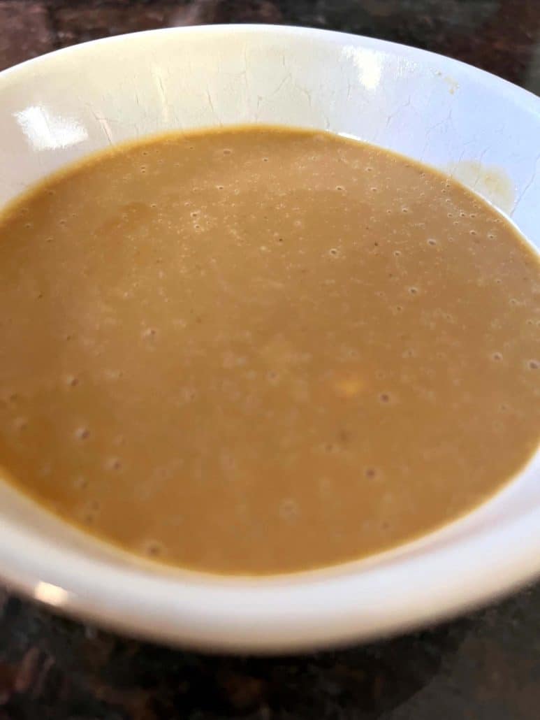 A close-up of a bowl filled with homemade Chick-Fil-A sauce, showcasing its smooth and creamy texture.