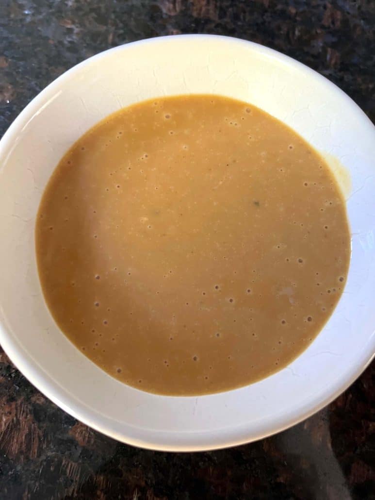 A bowl of smooth homemade Chick-Fil-A sauce, ready to be served.