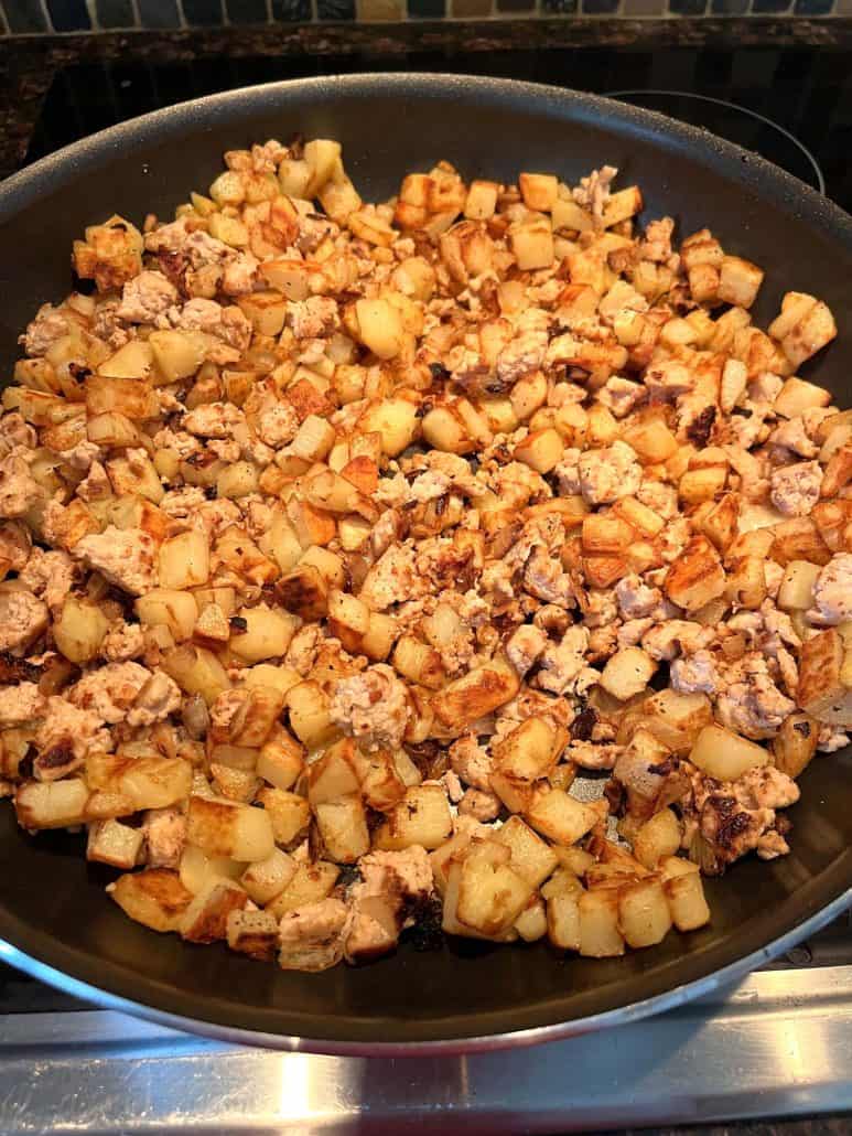 Perfectly browned and crispy texture of potatoes and ground turkey.