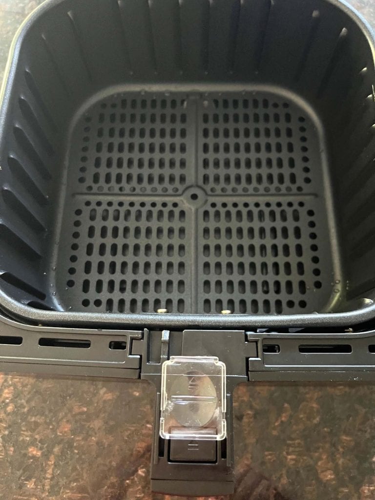 Fully cleaned and reassembled Cosori air fryer basket.