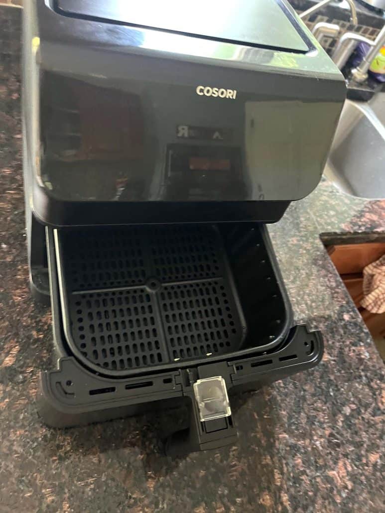 Top view of already cleaned, open Cosori Air Fryer basket.