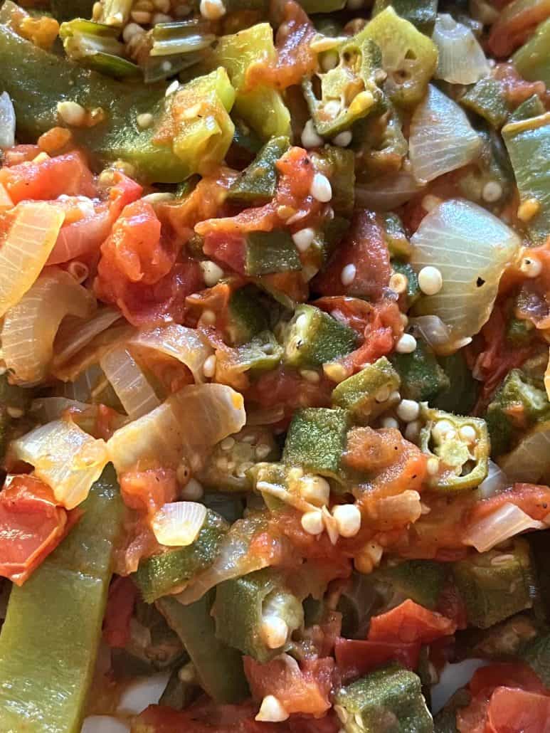 Close-up of sautéed okra, tomatoes, bell peppers, and onions, showing the tender and flavorful vegetables in the Okra and Tomatoes recipe. 