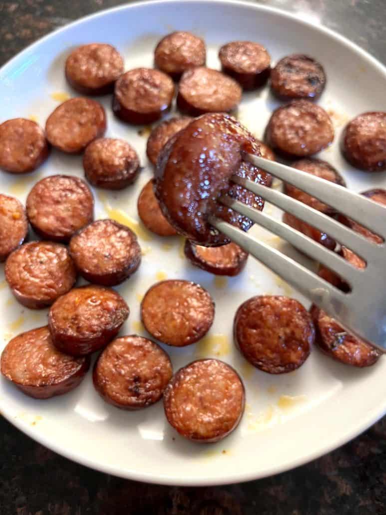 Andouille sausage from a plate, showcasing the crisp, juicy texture from the air fryer sausage recipe.