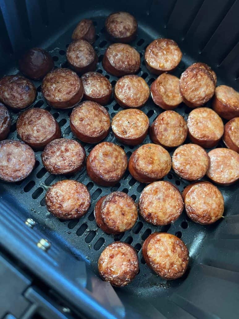 Perfectly browned andouille sausage slices, demonstrated in the air fryer.