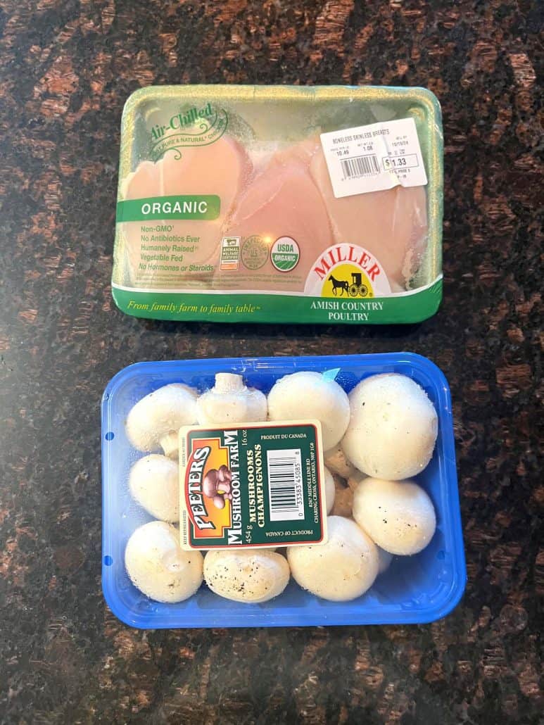 Fresh organic chicken breasts and a pack of whole white mushrooms for the Air Fryer Chicken and Mushrooms recipe..