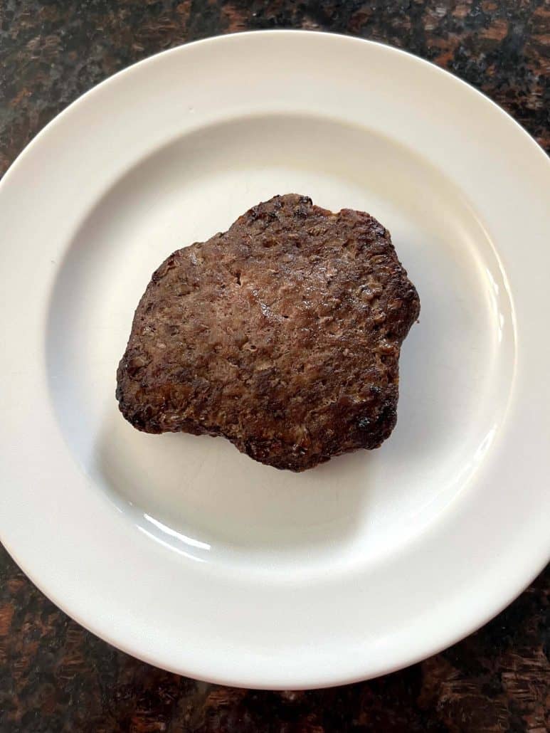 Single cooked Bubba Burger served on a white plate, ready to enjoy.