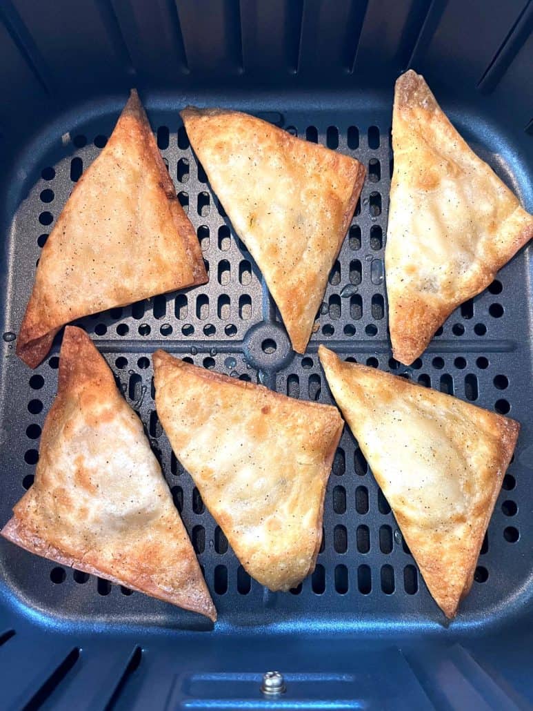 Six perfectly air-fried Buffalo Style Chicken Poppers with a golden, crispy finish in the air fryer basket.