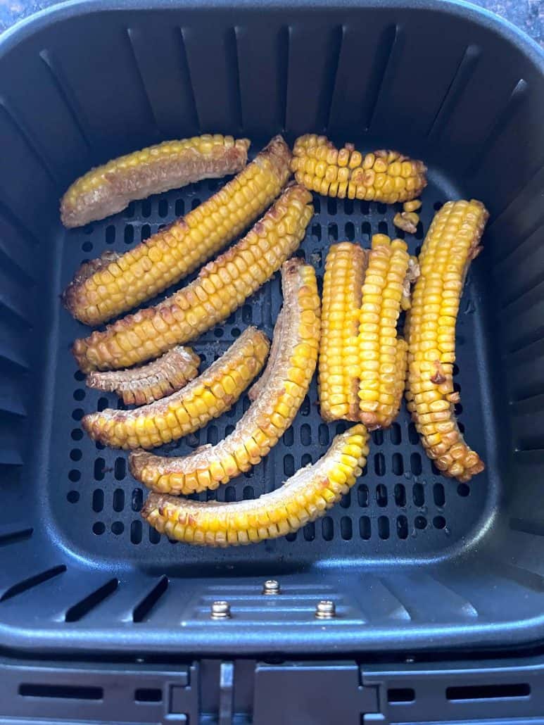 Cooked Trader Joe's seasoned corn ribs in the air fryer basket.