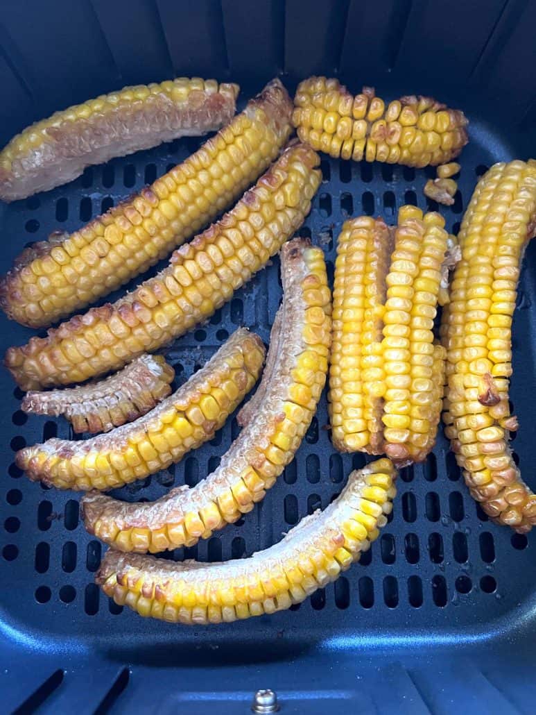 Golden-brown seasoned corn ribs freshly cooked in the air fryer.