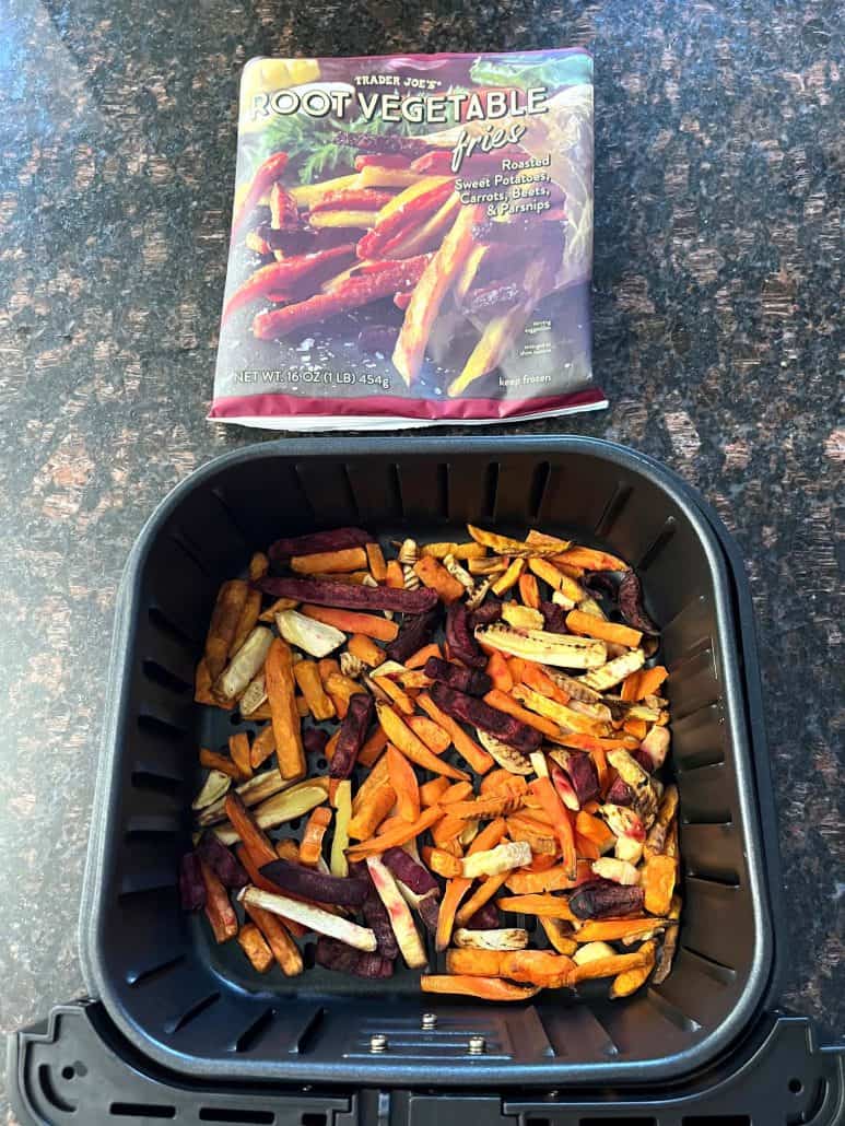 Frozen Trader Joe's Root Vegetable Fries placed in an air fryer basket, ready to be cooked as a nutritious and colorful side dish.