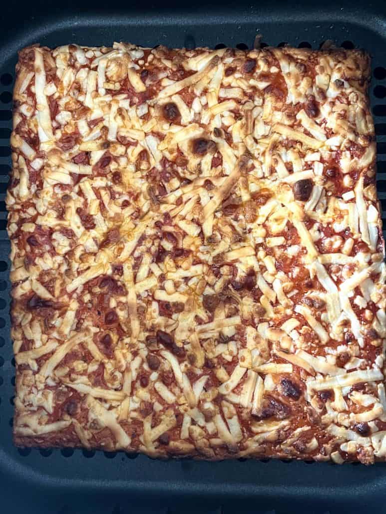 Close-up of Golden-brown Totino's Party Pizza, fresh from the air fryer.