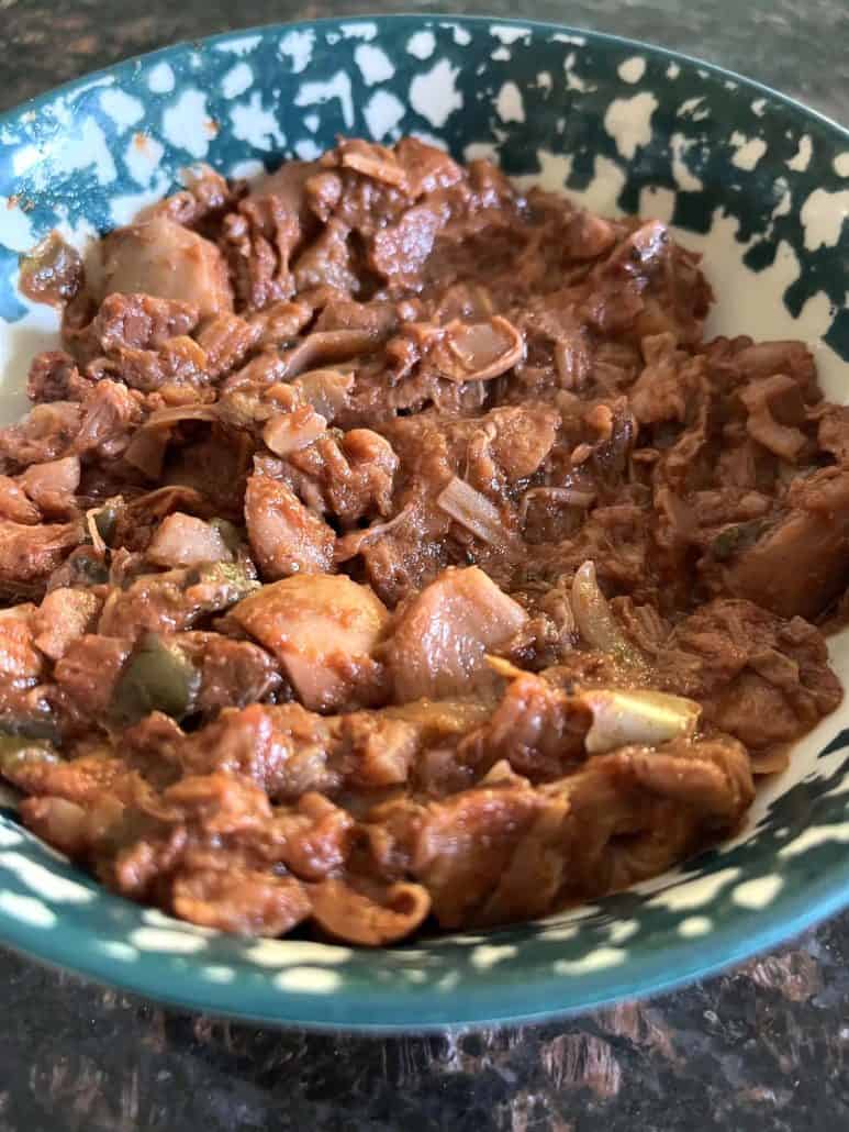 Bowl of cooked Tex-Mex jackfruit, perfect for tacos, wraps, or rice bowls.