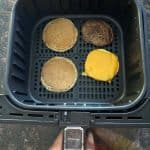 Air fryer basket with cooked Jimmy Dean Maple Griddle Cake.