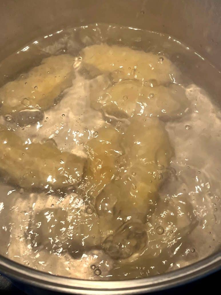 Close-up of Saba bananas boiling in a pot.