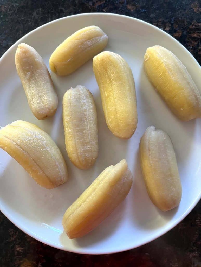 Saba bananas arranged on a white plate, ready to be served.