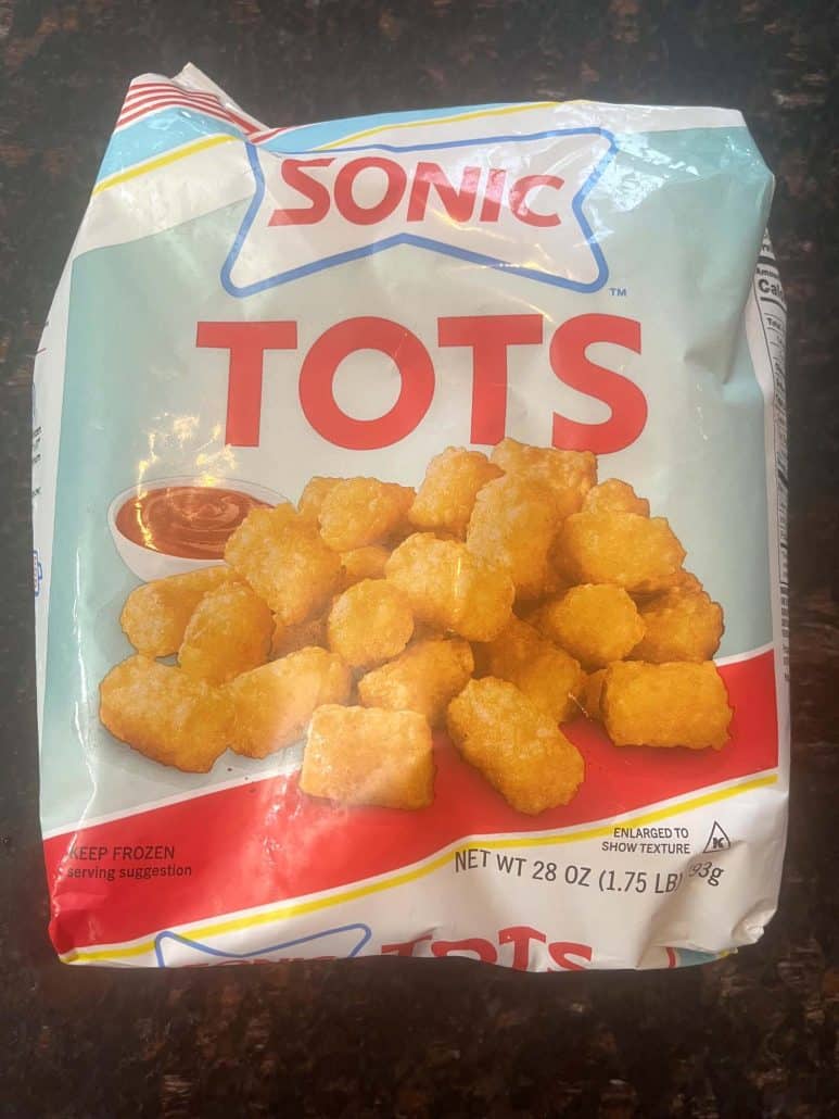 Package of frozen Sonic tater tots, ready to be cooked in the air fryer for a quick and crispy snack.