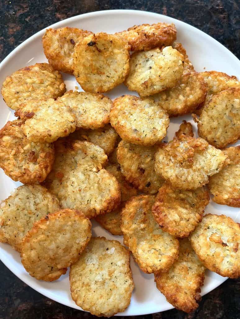 A plate filled with golden, crispy McCain Baby Cakes Hashbrowns.