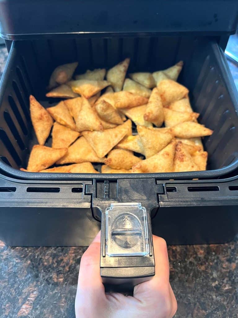 Golden, crispy Old El Paso Stuffed Nachos freshly cooked in an air fryer basket, ready to serve as a quick and delicious snack.