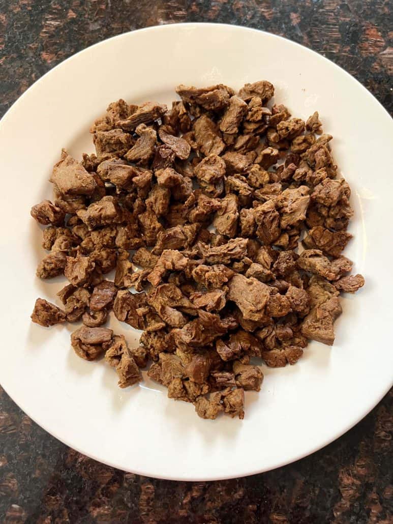 A plate of freshly cooked Beyond Steak Tips, showcasing their savory texture.