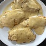 Plate of tender chicken breasts smothered in creamy Dijon mustard sauce, showcasing the rich and flavorful result of the easy Dijon Mustard Chicken recipe.