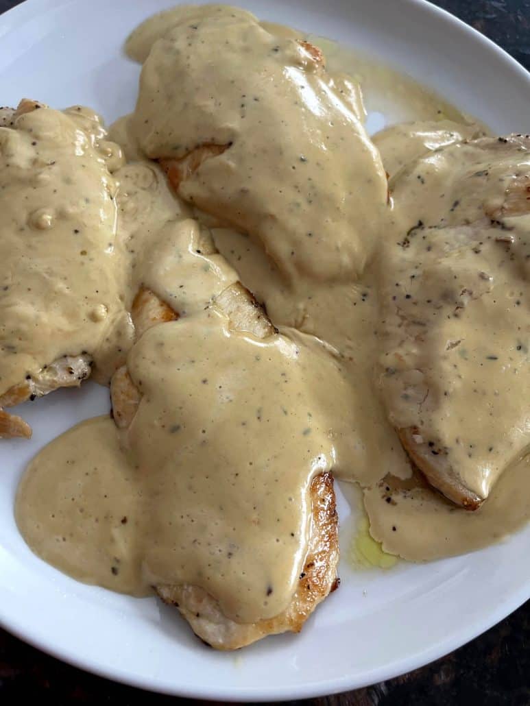 Dijon Mustard Chicken on a plate, covered in a creamy mustard sauce that highlights the recipe’s rich and savory flavors.