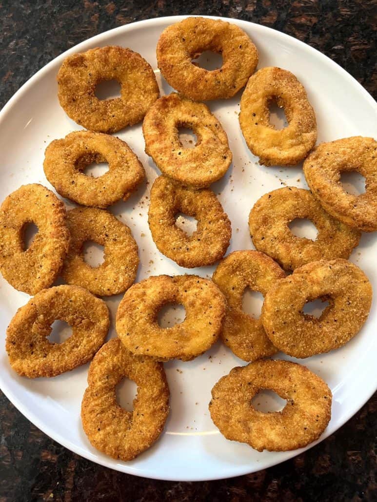 A plate of perfectly cooked, and crispy White Castle chicken rings. Quick snack option.