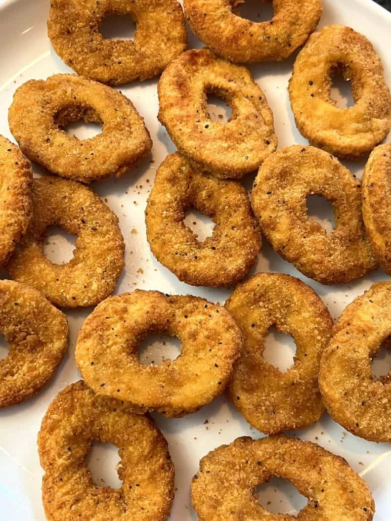 Close-up of golden brown White Castle chicken rings served on a plate.